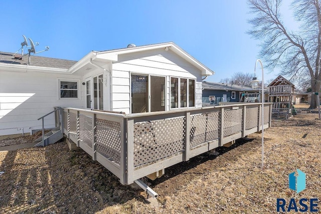 rear view of house with a wooden deck