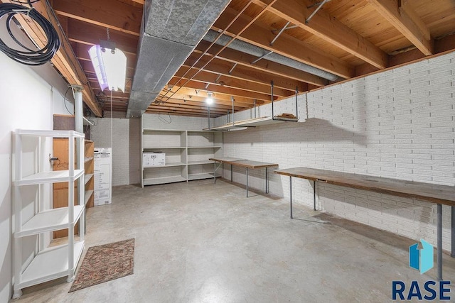 unfinished basement with brick wall