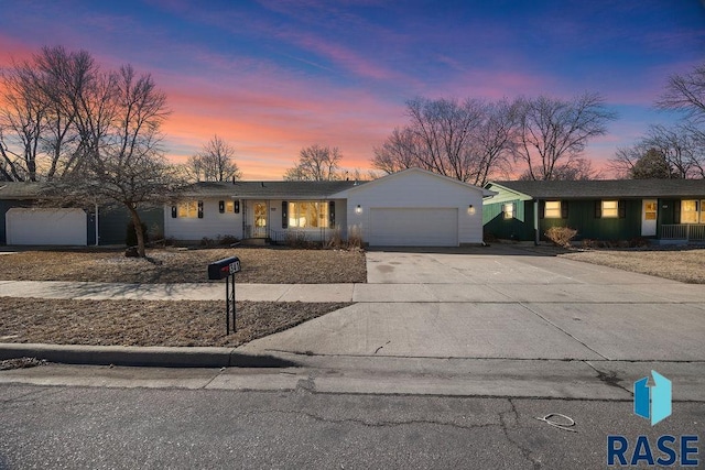 view of front of property featuring a garage and concrete driveway