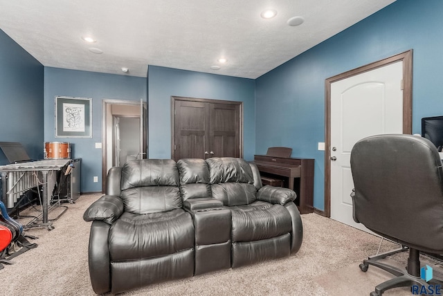 carpeted office space featuring recessed lighting, baseboards, and a textured ceiling