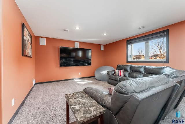 carpeted living room featuring recessed lighting and baseboards