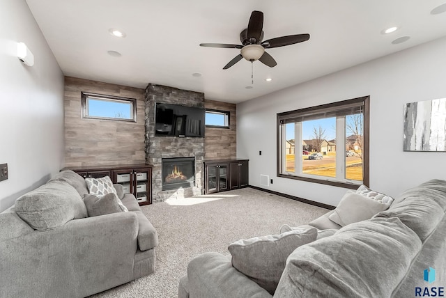 carpeted living area with recessed lighting, a fireplace, baseboards, and ceiling fan