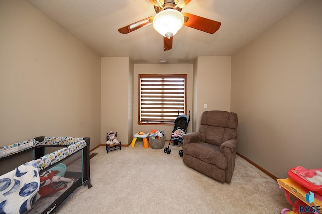 playroom with baseboards, carpet, and a ceiling fan