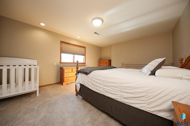 carpeted bedroom featuring recessed lighting, baseboards, and visible vents