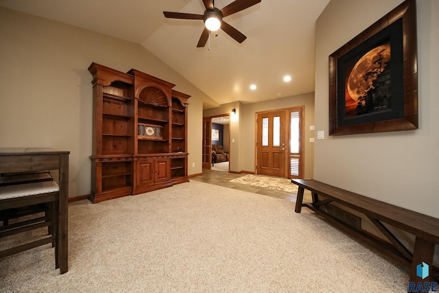 interior space featuring vaulted ceiling, baseboards, and ceiling fan