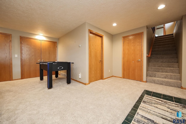 rec room featuring recessed lighting, baseboards, carpet, and a textured ceiling