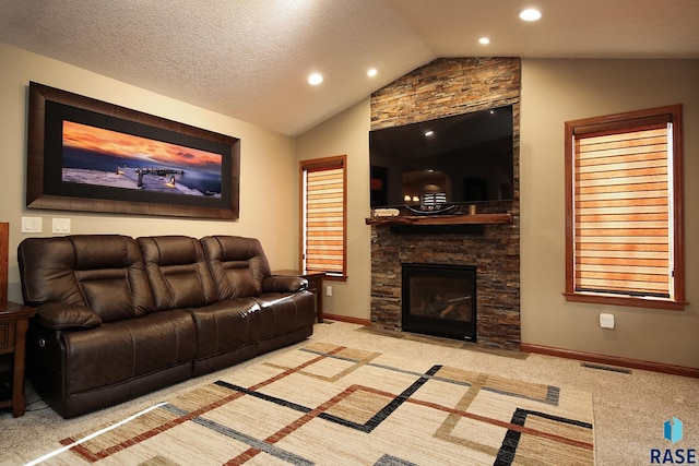 carpeted living room with lofted ceiling, a textured ceiling, recessed lighting, a fireplace, and baseboards