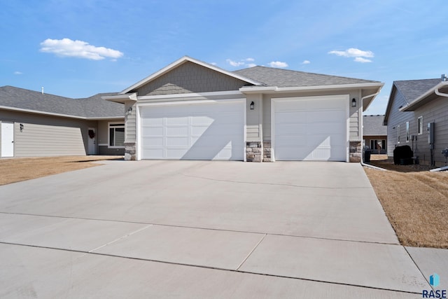 ranch-style house with an attached garage, stone siding, driveway, and a shingled roof