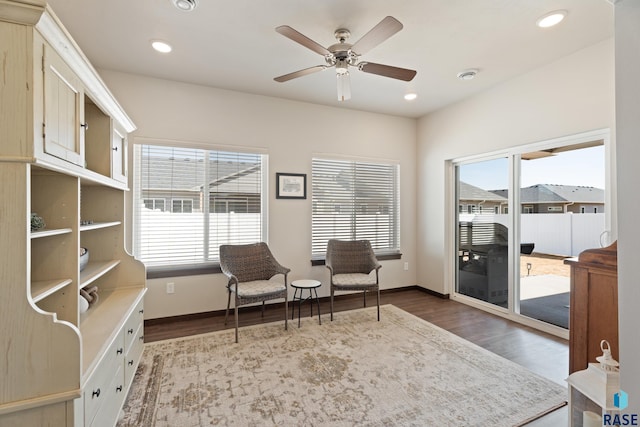 living area featuring dark wood finished floors, plenty of natural light, and recessed lighting