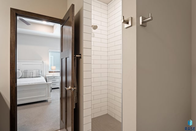 interior space featuring connected bathroom and a tile shower