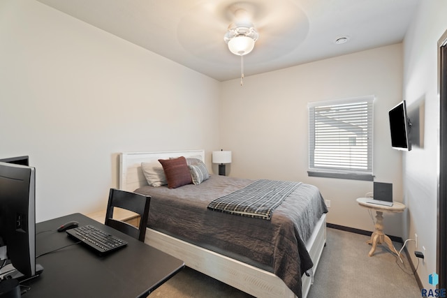 carpeted bedroom featuring a ceiling fan and baseboards