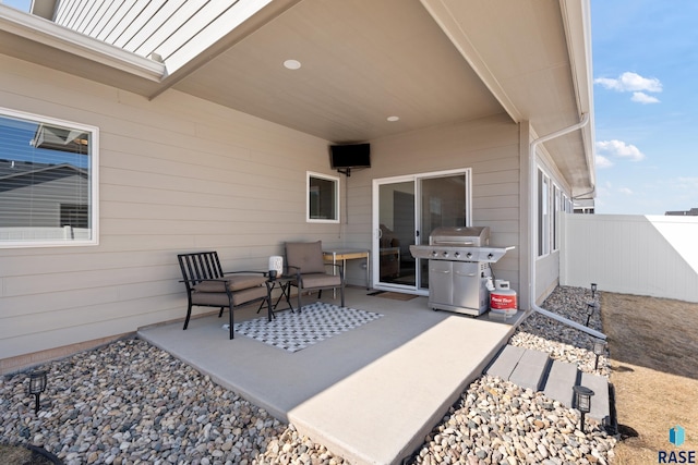 view of patio / terrace featuring fence and grilling area