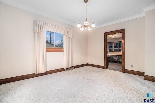 carpeted empty room with an inviting chandelier, visible vents, and baseboards