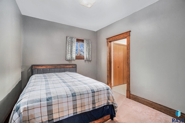 bedroom featuring baseboards and carpet floors