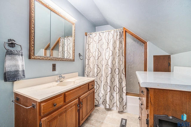 bathroom featuring visible vents, vanity, lofted ceiling, and shower / bath combo