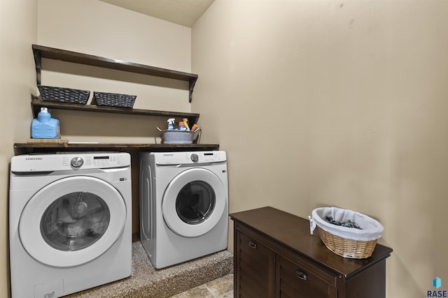 clothes washing area with laundry area and washer and dryer