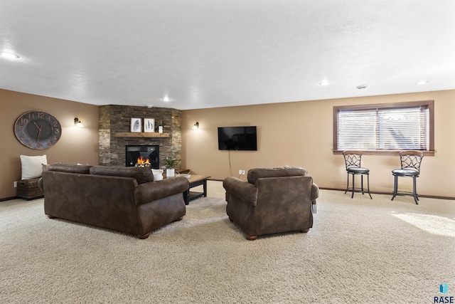 living room with recessed lighting, a fireplace, baseboards, and carpet floors