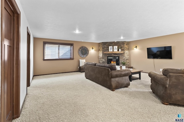 carpeted living room with a fireplace and baseboards