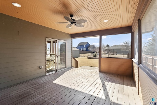 sunroom with wooden ceiling and ceiling fan