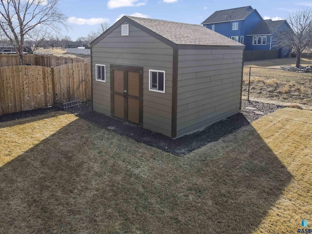 view of shed featuring a fenced backyard