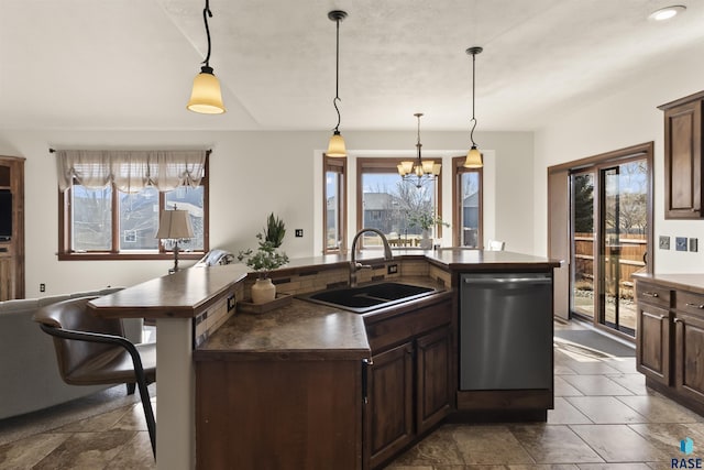 kitchen featuring a sink, stainless steel dishwasher, dark countertops, and dark brown cabinets