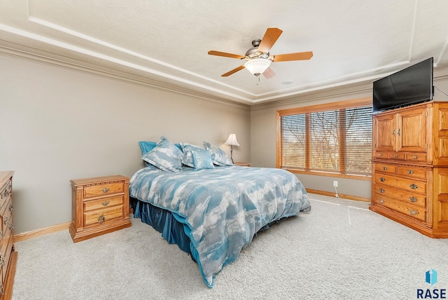 bedroom featuring ceiling fan, baseboards, light carpet, and ornamental molding