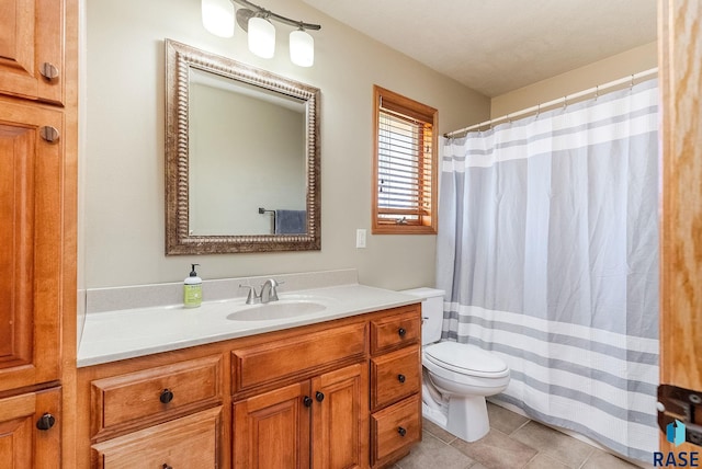 full bathroom featuring tile patterned floors, curtained shower, toilet, and vanity