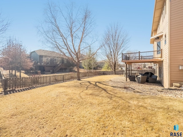 view of yard with stairs and a fenced backyard