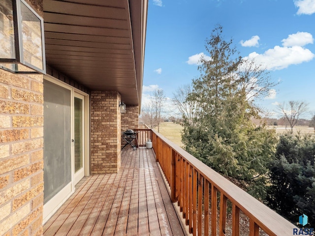 wooden terrace with area for grilling
