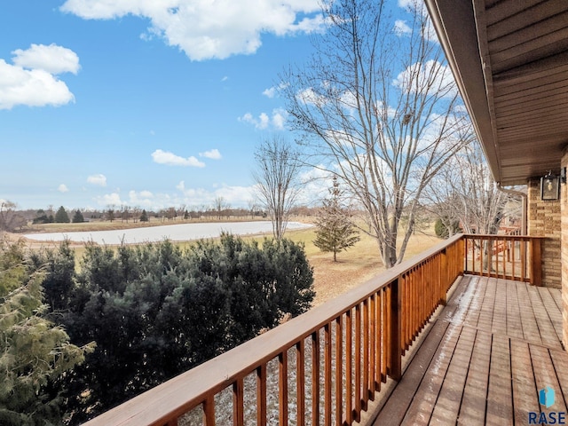 wooden deck with a water view