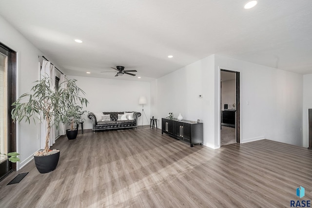 unfurnished living room featuring visible vents, recessed lighting, ceiling fan, and wood finished floors