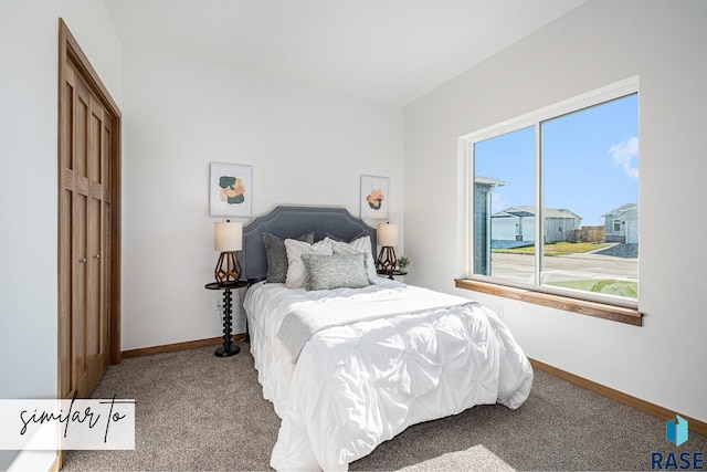 carpeted bedroom with baseboards