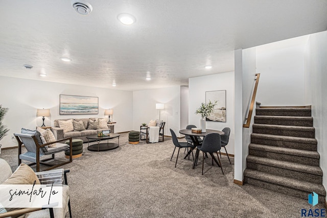 carpeted living area with visible vents, baseboards, a textured ceiling, and stairway