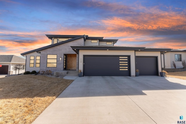 modern home with an attached garage and driveway