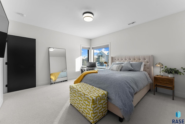 bedroom with visible vents, baseboards, and carpet flooring