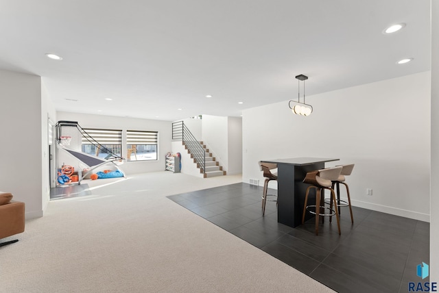 dining area with recessed lighting, stairway, baseboards, and dark carpet