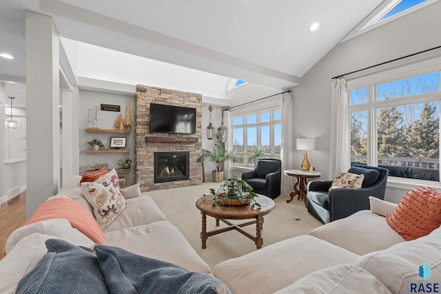 living room featuring recessed lighting, a fireplace, and high vaulted ceiling