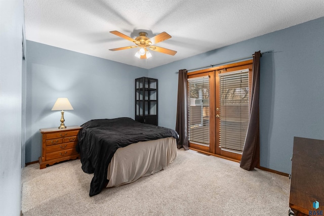 bedroom featuring light carpet, a ceiling fan, a textured ceiling, baseboards, and access to exterior