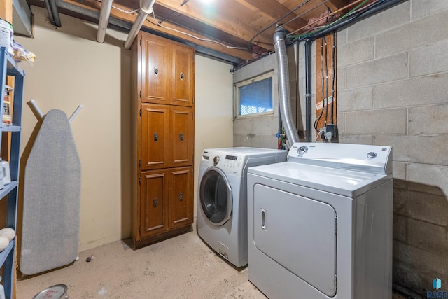 clothes washing area with laundry area and washing machine and clothes dryer