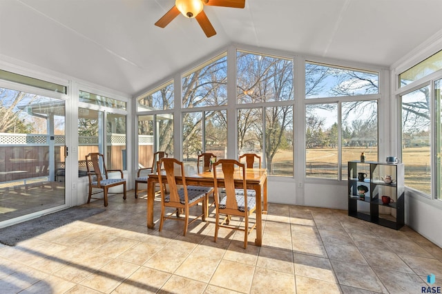 sunroom / solarium featuring lofted ceiling and ceiling fan