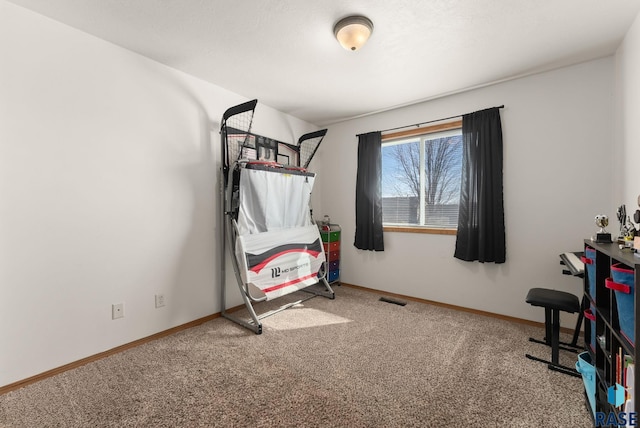 carpeted bedroom featuring visible vents and baseboards