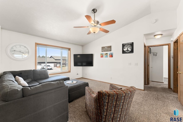 living room featuring baseboards, lofted ceiling, carpet, and a ceiling fan