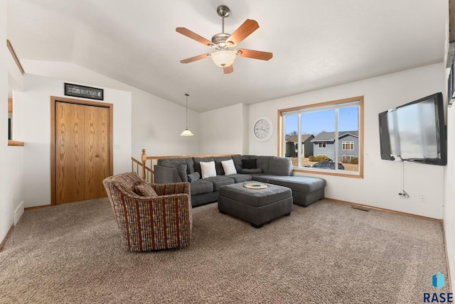 carpeted living area with visible vents, ceiling fan, baseboards, and lofted ceiling