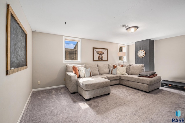 carpeted living area with visible vents and baseboards