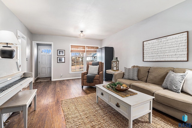 living room featuring dark wood finished floors and baseboards