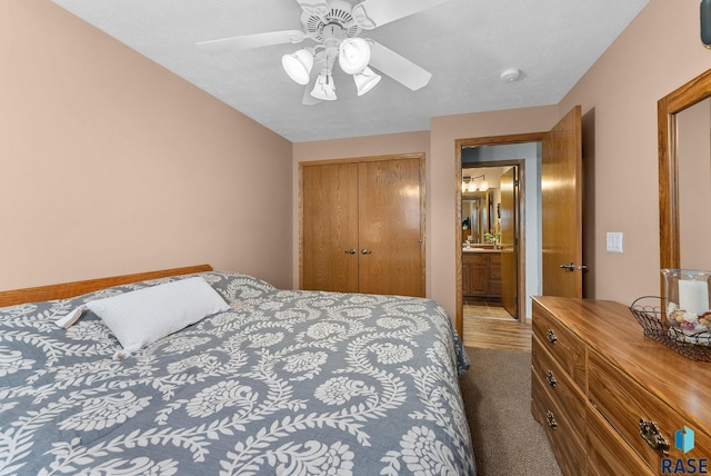 bedroom with a closet, ceiling fan, and carpet