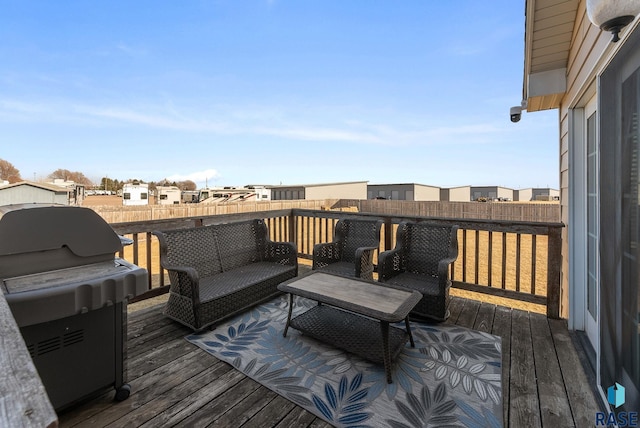 wooden deck featuring a residential view, an outdoor hangout area, and area for grilling