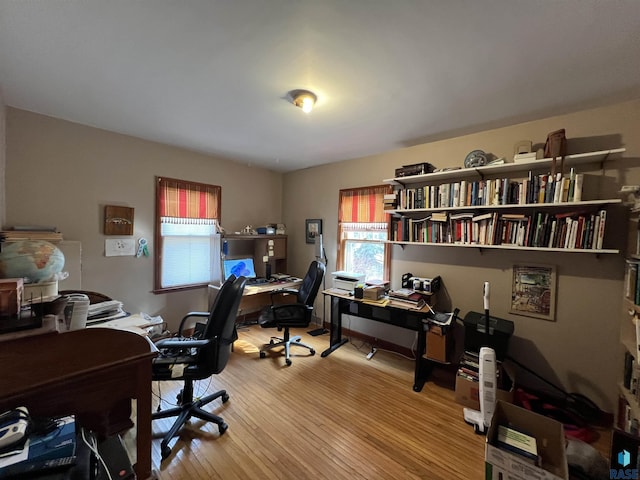 office area with wood finished floors