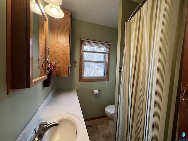 full bathroom with baseboards, toilet, a shower with shower curtain, tile patterned floors, and vanity