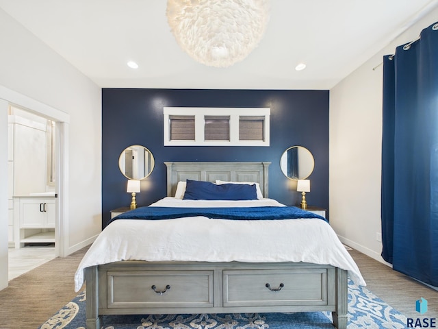 bedroom featuring light wood finished floors, recessed lighting, connected bathroom, and baseboards